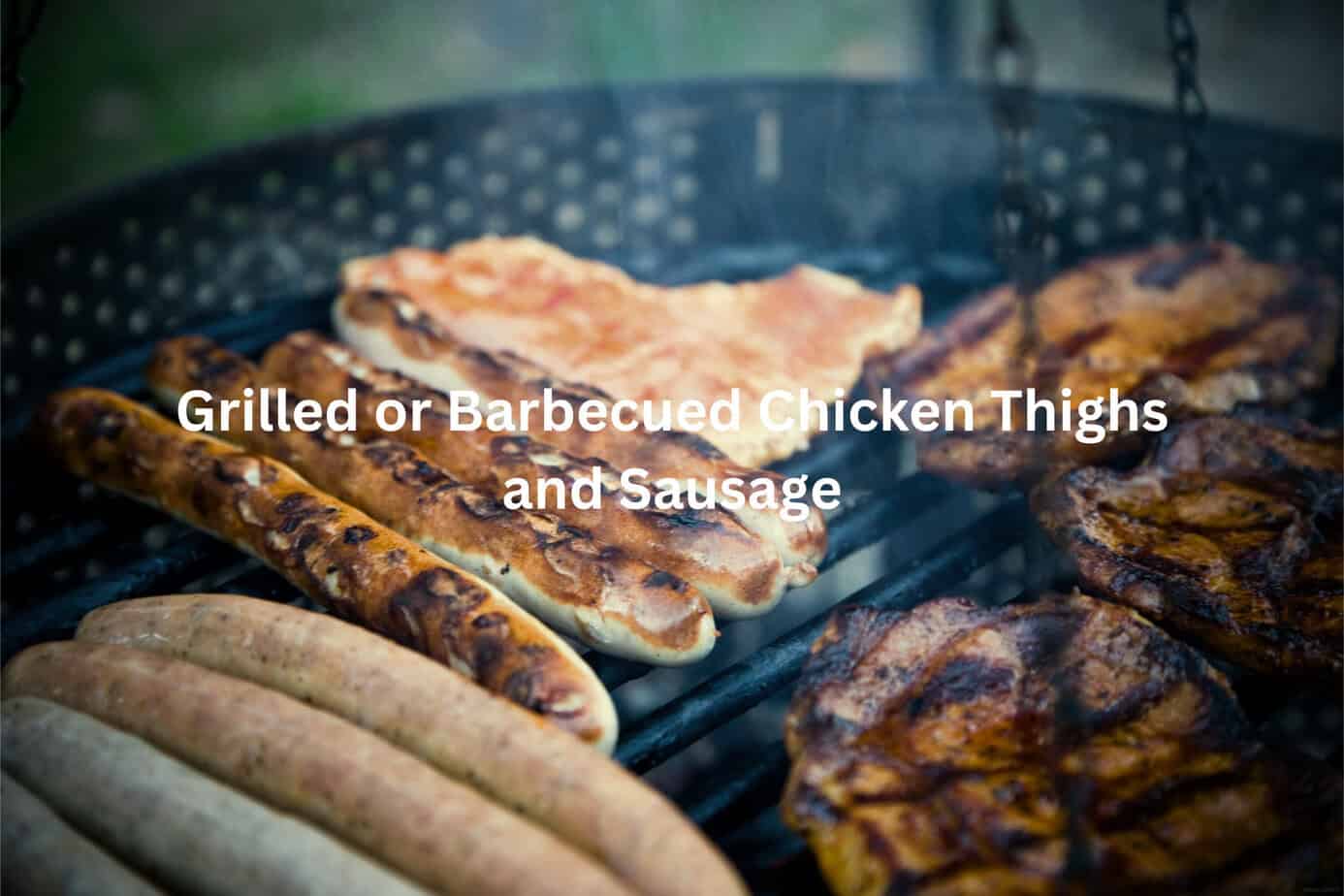 Grilled meats on a barbecue grill, including sausages and chicken thighs.