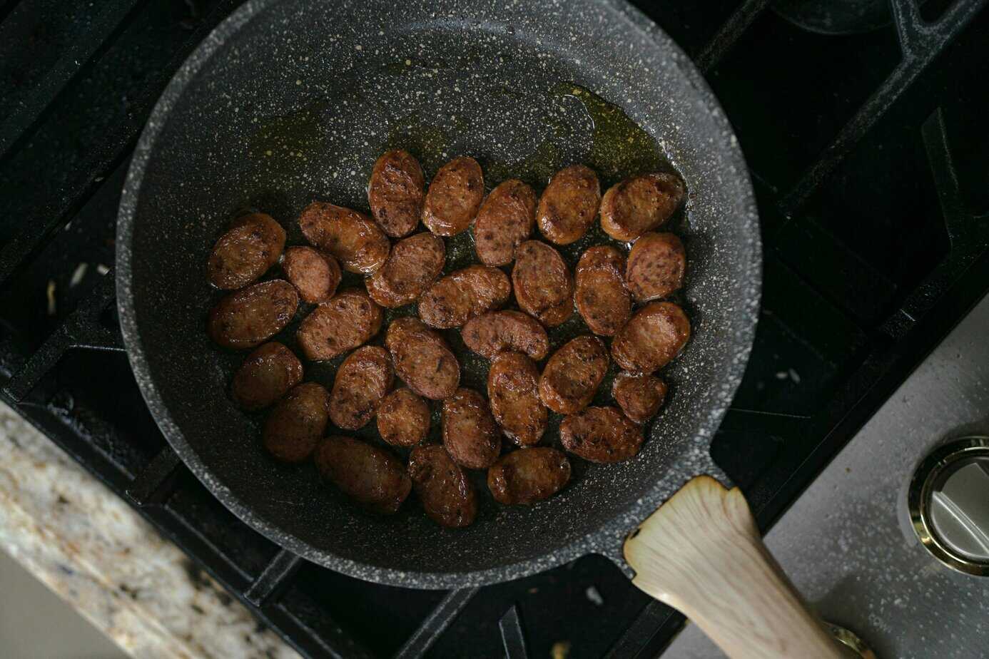 Sliced alfresco chicken sausage browning in a skillet,step in how to cook alfresco chicken sausage on stove top. Credit: Pixels.com (photo by chickenbunny)