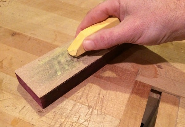 Putting compound on leather strop