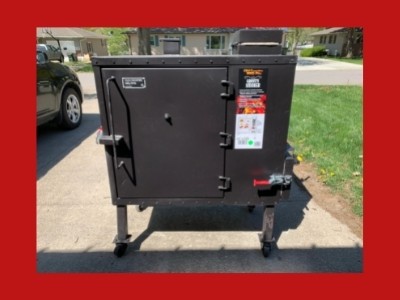 Gravity feed charcoal smoker