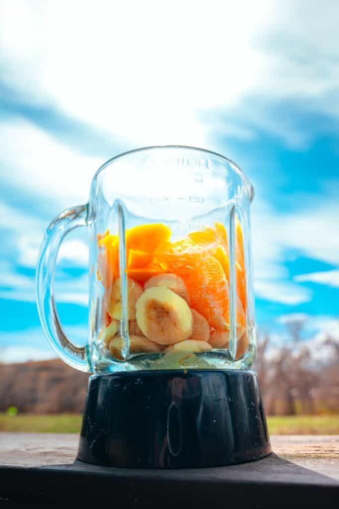 clear glass mug with black liquid inside