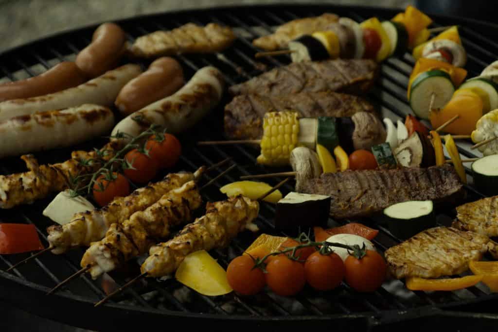 Grilled chicken sausage, meat, and colorful veggie skewers on a BBQ. Credits: pexels.com (Photo by Pixabay)