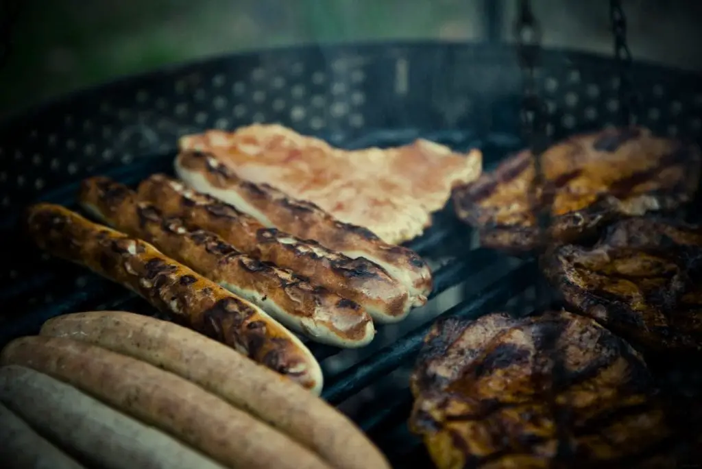 Grilled chicken sausage being cooked, perfect for white bean soup. Credits: pexels.com (Photo by Markus Spiske)