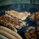 Grilled chicken sausage being cooked, perfect for white bean soup. Credits: pexels.com (Photo by Markus Spiske)