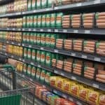 Shopping aisle with various sausages; find out where to buy Delia's chicken sausage.