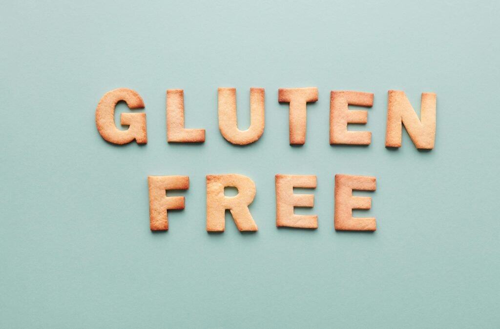 Cook The Restaurant's Food at Home 32 Cookies shaped as letters spelling "GLUTEN FREE," relating to the question, "Are chicken sausages gluten-free?"