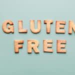 Cookies shaped as letters spelling "GLUTEN FREE," relating to the question, "Are chicken sausages gluten-free?"