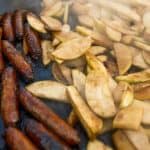 Chicken apple sausage served with fresh herbs, highlighting its protein-rich and nutritious ingredients.