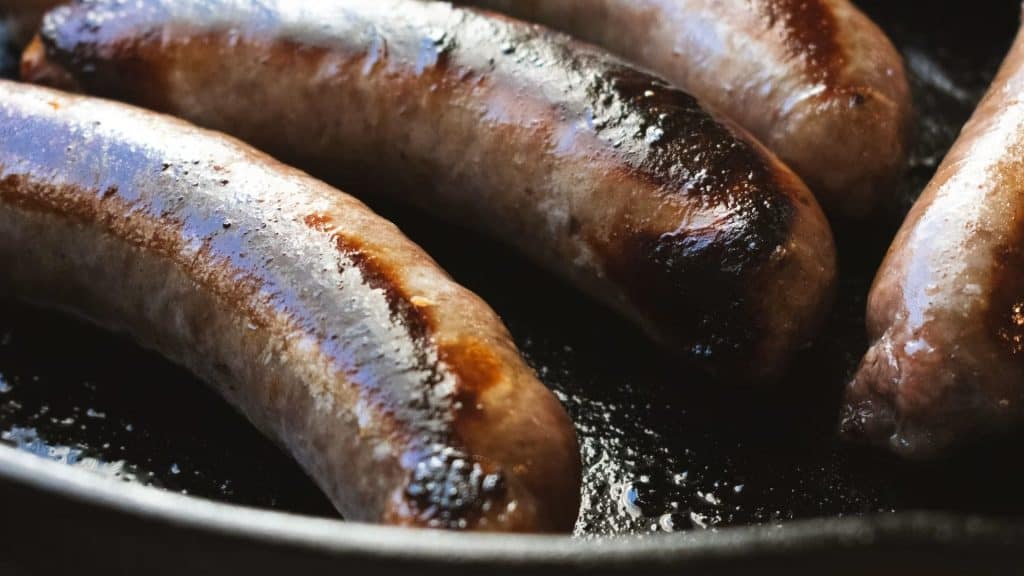 A healthy diet, proper hydration, and moderate portions matter more than chicken sausage alone for preventing constipation.
