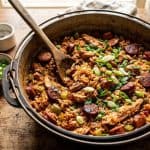 Chicken and Sausage Jambalaya: Easy 1-Pot Recipe 4 A pot of chicken and sausage jambalaya garnished with green onion, ready to serve